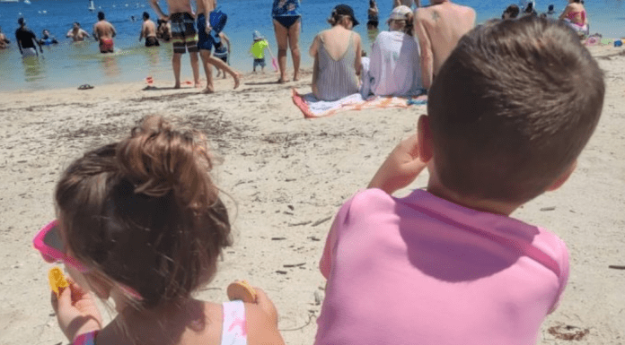 Two kids enjoying a day at the beach