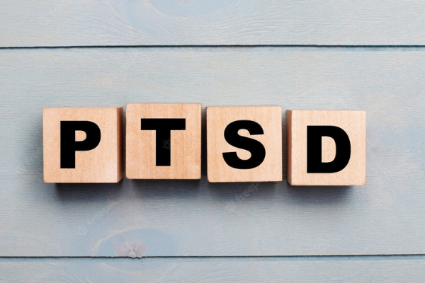 Letter tiles spelling out PTSD