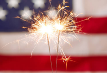 Image: Sparkler fireworks with an American flag in the background