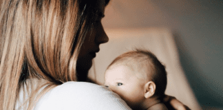 A mother holding her newborn baby