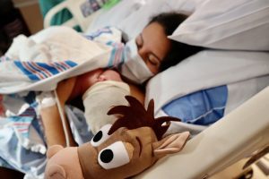 Daniella holding her newborn son