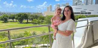 Rachel and her daughter at Frost Science, with the Miami skyline behind them