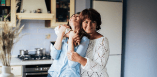 Mom giving hugs goodbye to her new college student
