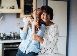 Mom giving hugs goodbye to her new college student