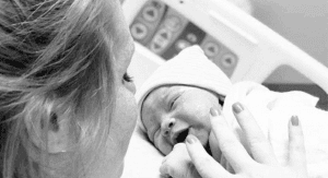 Image: Mom getting ready to breastfeed for the first time in the hospital