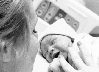 Mom getting ready to breastfeed for the first time in the hospital