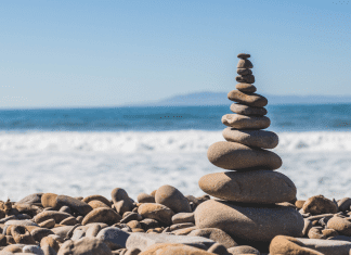 A pile of rocks stacked on the shore