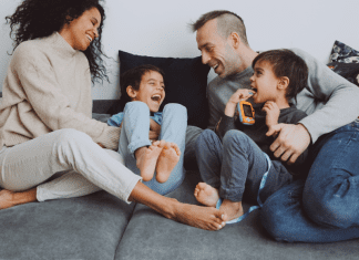 A family hanging out a laughing together