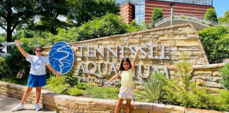 Two girls pose for a picture at the Tennessee Aquarium