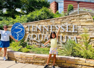 Two girls pose for a picture at the Tennessee Aquarium