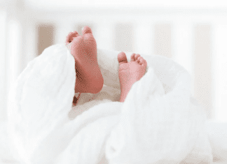 Baby feet sticking out from a blanket