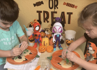 Decorating pumpkin cookies