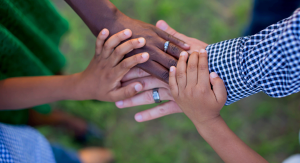 A family putting their hands together