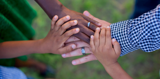 A family putting their hands together