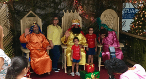 Children posing for photos with the Three Kings