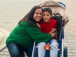 5 Tips for Visiting Family With a Child With Special Needs Image of a mother hugging her son on a trip