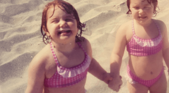 2 toddler girls happy on the beach