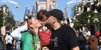 Sandra and her family pose for a photo at Magic Kingdom