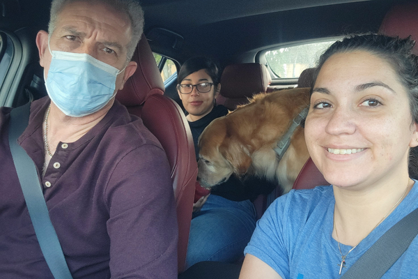 Image: Minnie in the car with family members