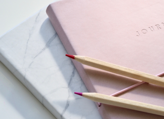 Image: A journal, notebook, and set of pencils