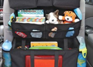 Image: A seatback organizer with water bottles, toys, and other essentials for the car