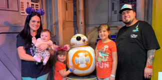 May the 4th be With You: 4 Fun Crafts to Make With Your Kids Image: A family poses for a photo with BB-8