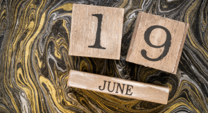Image: A wooden block calendar that reads June 19