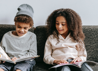 Image: Two children reading books together