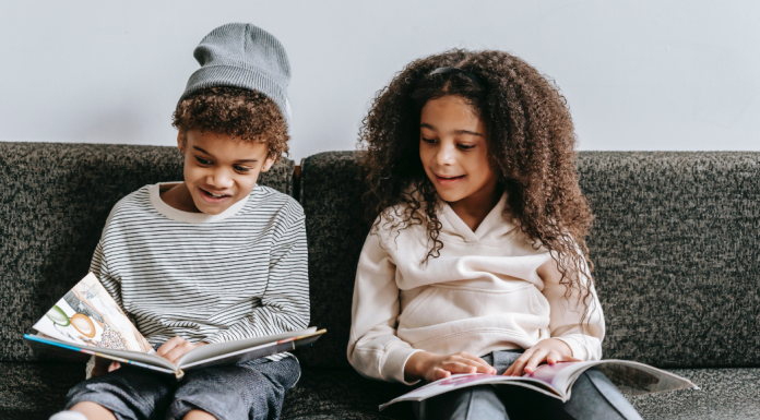 Image: Two children reading books together