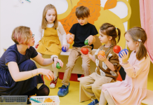 Image: A teacher works with a small group of students who may have IEPs