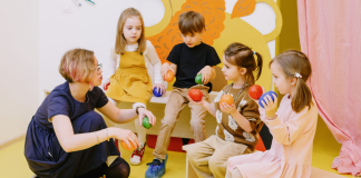 IEPs: 5 Reminders From a School-Based SLP Image: A teacher works with a small group of students who may have IEPs