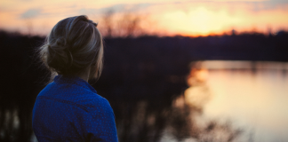 Starting A New Chapter Image: A woman looks out on a lake