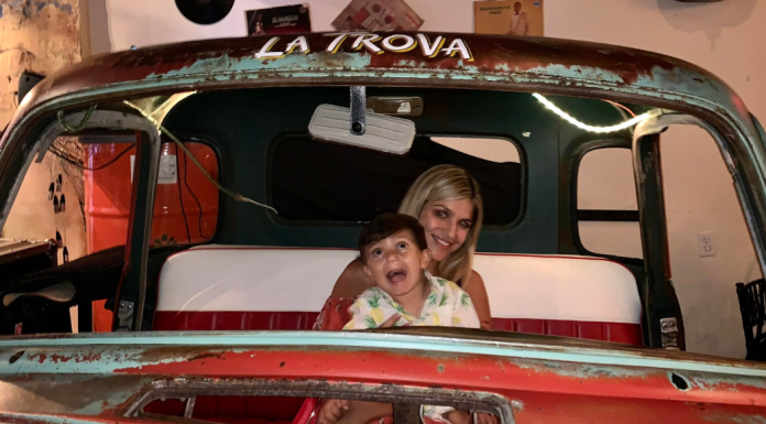 Image: A mother and son at Cafe la Trova, a local Cuban restaurant in Miami