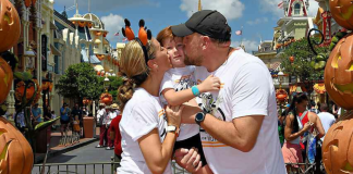 Image: A family poses for a fall-themed photo on Main Street