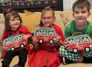 Image: Children holding holiday gifts