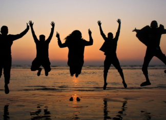 Image: A group of friends jumping in the air for a photo