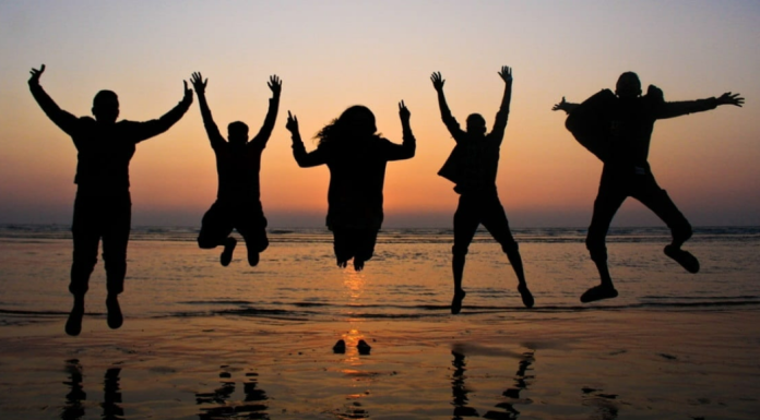 Image: A group of friends jumping in the air for a photo