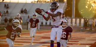 Image: A high school football player catches a touchdown
