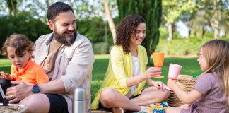 Image: A family enjoys an outdoor picnic at the park