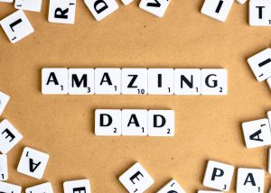 Image: Scrabble tiles spelling out "Amazing Dad"