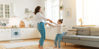 Managing Mom Guilt: Finding Balance and Overcoming Challenges Image: A mom and daughter dance in the living room