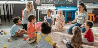 Your Child’s Teacher: 7 Things They Want You to Know Image: Teachers sit in a circle with their students