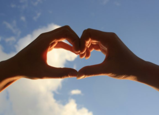 Image: Two hearts form a heart against a blue sky