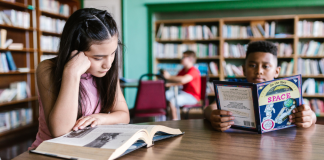 Image: Children read books at a local library