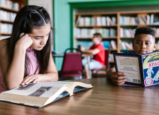 Image: Children read books at a local library