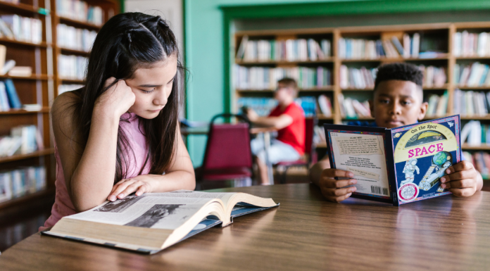 Image: Children read books at a local library