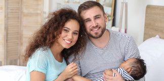 4 Reasons for Choosing Adoption with Adoption Choices of Florida Image: Parents holding their infant