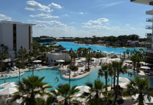 Image: A balcony view of the pool and lagoon at Conrad Orlando