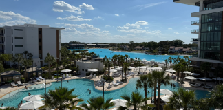 Image: A balcony view of the pool and lagoon at Conrad Orlando