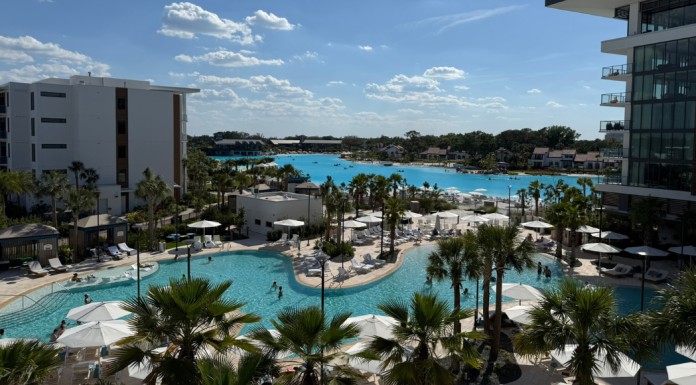 Image: A balcony view of the pool and lagoon at Conrad Orlando